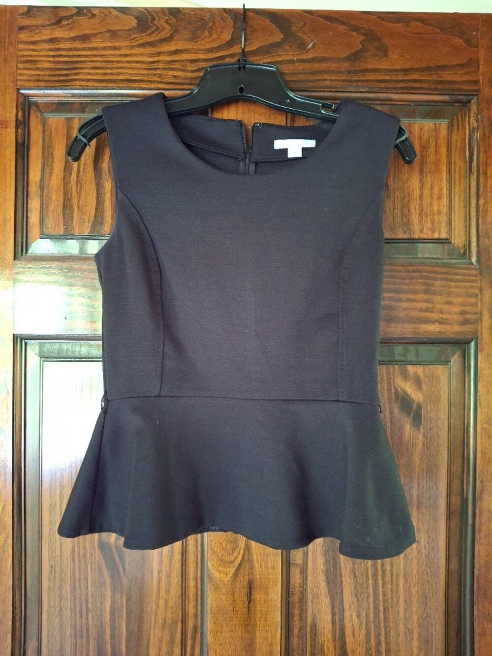 Black sleeveless work blouse